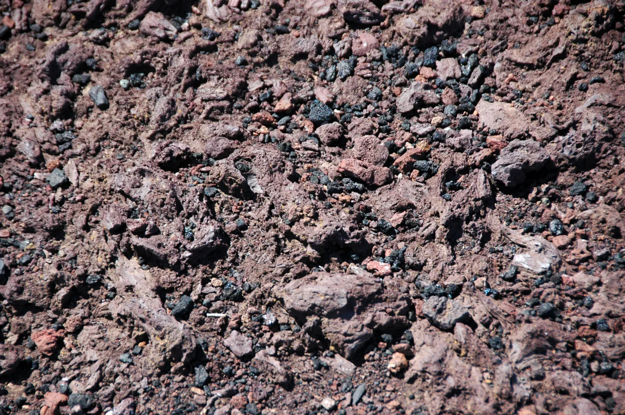 Weathered reddish-brown basalt rocks at Inferno Cone in Idaho; not basalt powder